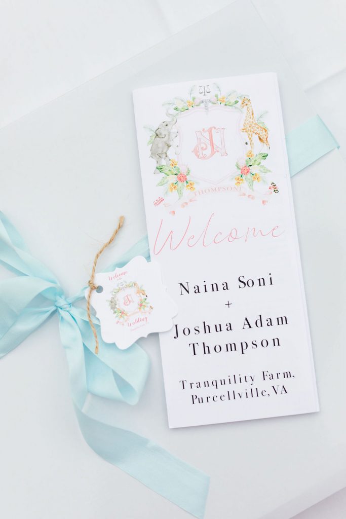 Welcome notes with the weekend itinerary and gift tags were made with their custom watercolor wedding crest!