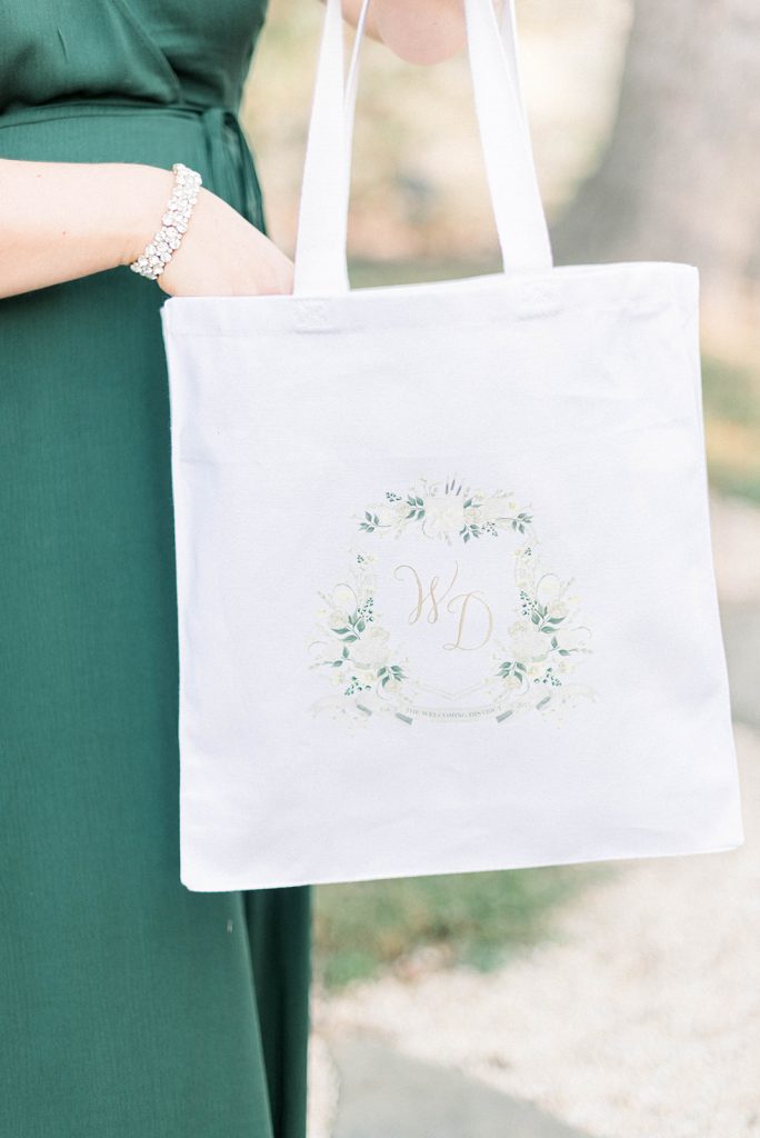 Watercolor wedding crest tote bag by The Welcoming District. Visit thewelcomingdistrict.com to get started!