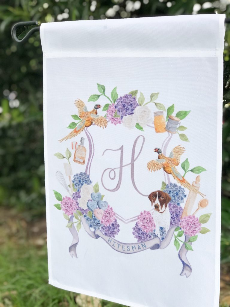A family crest garden flag by The Welcoming District.