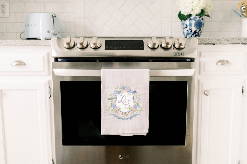 Watercolor crest tea towel by Alicia Betz of The Welcoming District.