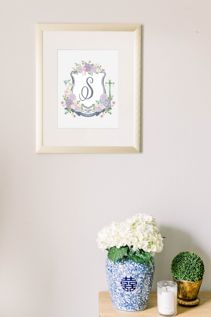A framed wedding crest by Alicia Betz of The Welcoming District.